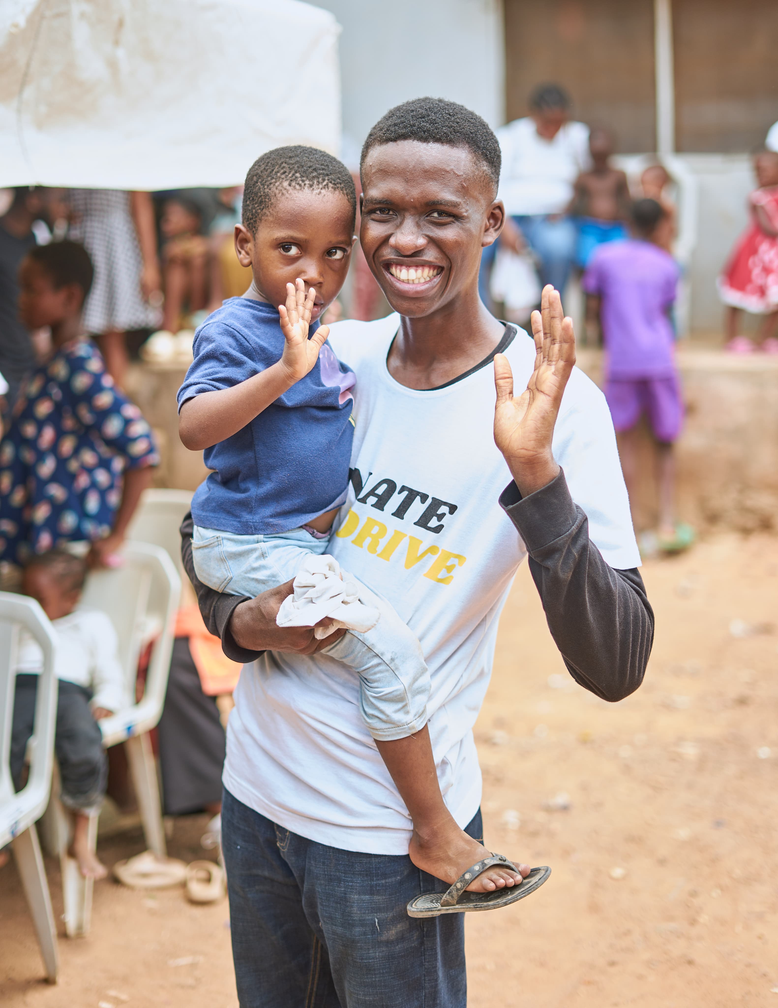 Donate Drive volunteer with children